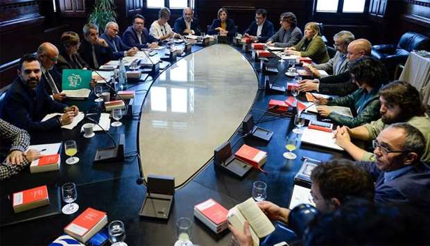 President of the Catalan parliament Carme Forcadell (C) attends a meeting with parliament representa