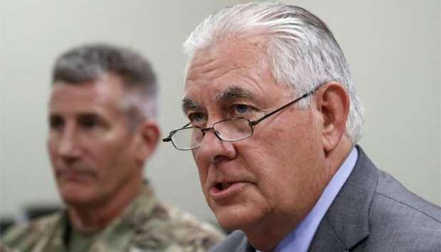 US Secretary of State Rex Tillerson speaks next to General John Nicholson at Bagram Air Field in Afghanistan on Monday.