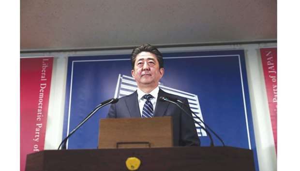 Japanu2019s Prime Minister and ruling Liberal Democratic Party leader Shinzo Abe attends a press conference at the party headquarters in Tokyo yesterday, a day after Japanu2019s general election. Prime Minister Shinzo Abe stormed to a landslide u201csuper-majorityu201d in snap Japanese elections, near complete projections showed Monday, with the hardline nationalist immediately pledging to u201cdeal firmlyu201d with North Korea.