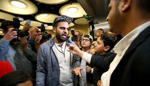 Irish citizen Ibrahim Halawa speaks to the press after arriving at Dublin Airport on October 24, 2017 following his release from detention in Egypt.