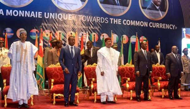 (L-R) Nigeria's Presidents Muhammadu Buhari, Togo's President Faure Gnassingbe, Niger's President Mahamadou Issoufou, Ivory Coast President Alassane Ouattara and Ghana's President Nana Akufo Ado attend the opening of a summit of heads of state of the Economic Community of West African States (ECOWAS) in Niamey on the creation of of a single currency of ECOWAS