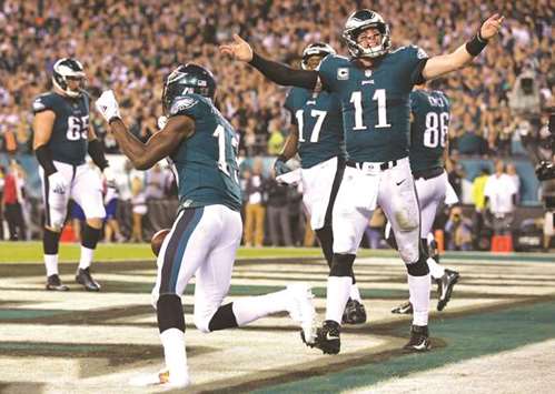 Philadelphia Eagles wide receiver Nelson Agholor (No 13) celebrates with quarterback Carson Wentz (No 11) after his touchdown catch during the fourth quarter of their NFL game against the Washington Redskins at Lincoln Financial Field. PICTURE: USA TODAY Sports