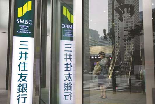 A woman stands inside a Sumitomo Mitsui Banking Corp branch in Tokyo (file).  SMBC is looking to back a push by Japanese firms planning to invest in Malaysiau2019s Shariah-compliant halal market, an official has said.