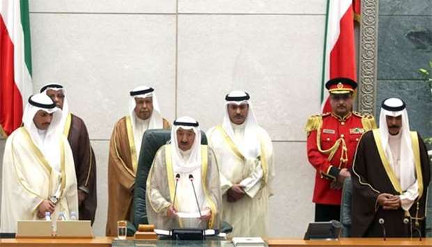 The Emir of Kuwait Sheikh Sabah al-Ahmad al-Sabah speaks as Kuwaiti crown prince Sheikh Nawaf al-Ahmad al-Sabah (right) and Kuwaiti parliament speaker Marzouq al-Ghanim (left) listen on during the opening ceremony of the new legislative year at the National Assembly in Kuwait City, on Tuesday.