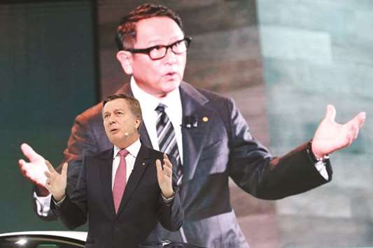 Toyota Motoru2019s executive vice president Didier Leroy presents the companyu2019s Concept-i series as a screen shows the companyu2019s president Akio Toyoda during media preview of the 45th Tokyo Motor Show yesterday. The company needs clarity on the terms of Britainu2019s access to European Union markets after Brexit to secure production at its Burnaston plant in central England, he said yesterday.
