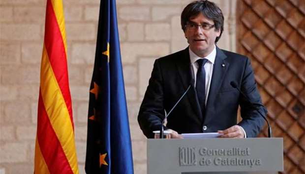 Catalan President Carles Puigdemont delivers a statement at the regional government headquarters in Barcelona on Thursday.