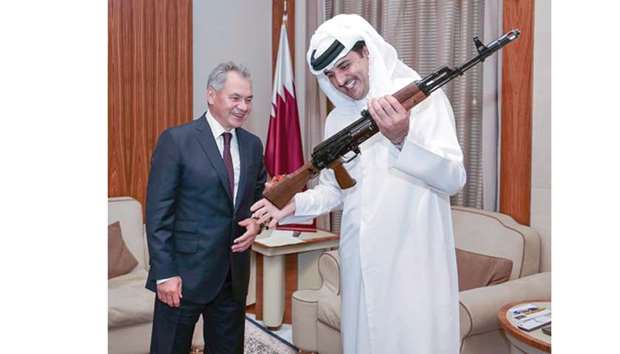 His Highness the Emir Sheikh Tamim bin Hamad al-Thani receives the gift of a Kalashnikov rifle from Russian Defence Minister Sergey Shoygu.