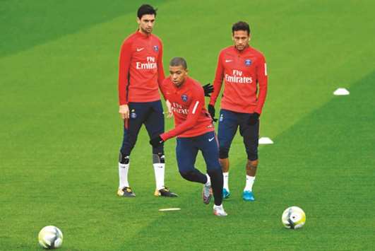 Paris Saint-Germainu2019s Javier Pastore (left), Neymar (right) and Kylian Mbappe take part in a training session in Saint-Germain-en-Laye on Wednesday. (AFP)