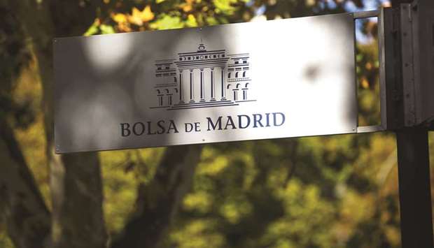 A sign hangs outside the Madrid Stock Exchange. The IBEX 35 ended the session around 1.5% lower at 10,197.50 points yesterday.