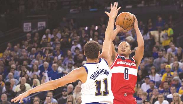 Washington Wizards guard Tim Frazier (8) shoots the basketball against Golden State Warriors guard Klay Thompson (11) during the second quarter at Oracle Arena. PICTURE: Kyle Terada-USA TODAY Sports