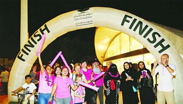 Families participate in Qatar Foundationu2019s breast cancer awareness walk