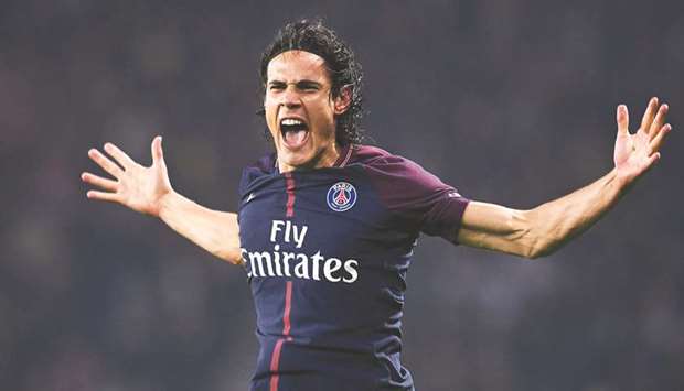 Paris Saint-Germainu2019s Uruguayan forward Edinson Cavani celebrates after scoring a goal during the French league match with Nice at the Parc des Princes stadium in Paris. (AFP)