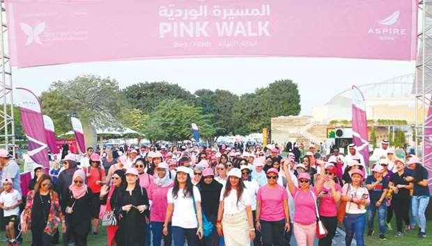 A large number of people participated in Aspire Zone Foundationu2019s u2018Pink Walku2019 breast cancer awareness event, which took place for the third consecutive year at Aspire Park yesterday. The event, part of AZFu2019s corporate social responsibility activities, was organised in collaboration with Qatar Cancer Society. The participants attended an awareness lecture before gathering in formation to create a u2018human ribbonu2019, attempted for the first time ever in Aspire, followed by a 1km walk around the Park. PICTURE: Ram Chand