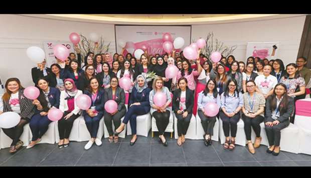 Ali Bin Ali Group employees mark the occasion.