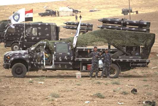 Iraqi forces gather at their camp on the frontline in the northwestern town of Fishkhabur, near the borders with Syria and Turkey, yesterday.