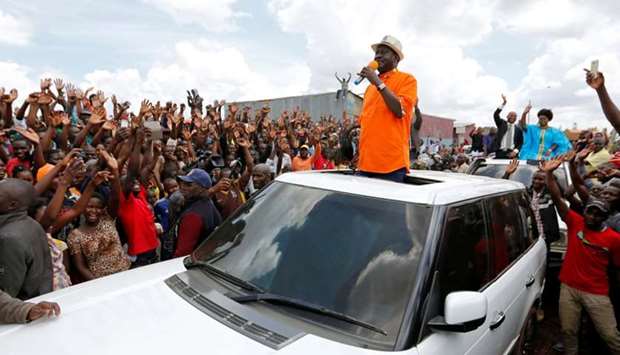 Kenyan opposition leader Raila Odinga of the National Super Alliance (NASA) coalition addresses his supporters after attending a church service in Kawangware slums in Nairobi, Kenya