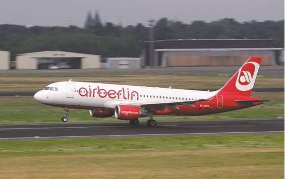 An Air Berlin passenger aircraft lands at Tegel airport in Berlin. The last flight of the airline landed in Berlin Tegel at 20.45 GMT on Friday.