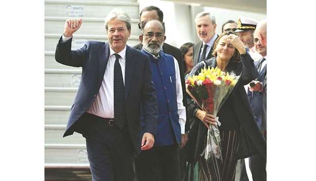 Italian Prime Minister Paolo Gentiloni and his wife Emanuela Gentiloni arrive at Palam Air Force station in New Delhi yesterday.