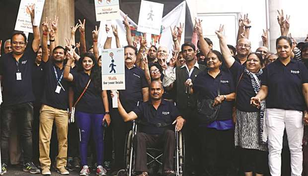 People participate in a walkathon organised by a private hospital to raise awareness about strokes in New Delhi yesterday.