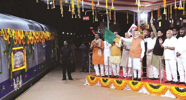 Prime Minister Narendra Modi flags off the first train on the new line from Bidar station to Kalaburgi in Karnataka yesterday.