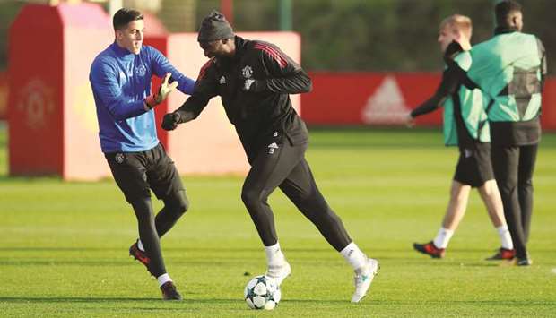 Manchester Unitedu2019s Romelu Lukaku and Joel Castro Pereira (left) joke around during training in Manchester, Britain, yesterday.  (Reuters)