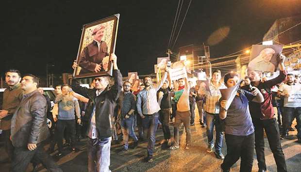 Demonstrators gather in the streets in support of Kurdish president Massoud Barzani in Duhok, Iraq.