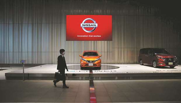 A man walks in the Nissan showroom at the carmakeru2019s headquarters in Yokohama. The company will recall all 1.2mn new passenger cars it sold in Japan over the past three years after discovering final vehicle inspections were not performed by authorised technicians, it said yesterday.