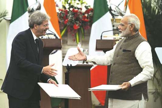 Prime Minister Narendra Modi and his Italian counterpart Paolo Gentiloni shake hands after an agreement signing ceremony at Hyderabad House in New Delhi yesterday.