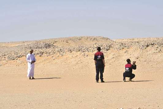 Members of the Austrian Space Forum inspect a site in Omanu2019s Dhofar desert, near the southern Marmul outpost, in preparation for a four-week Mars simulation mission due to begin next year.