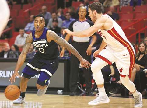 Jeff Teague of the Minnesota Timberwolves drives on Goran Dragic of the Miami Heat during their NBA game in Miami. (Getty Images/AFP)