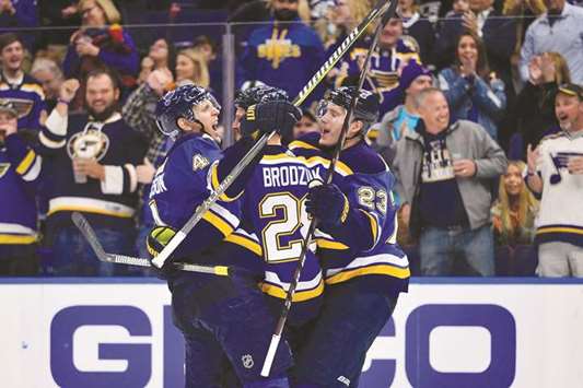 St. Louis Blues defenseman Carl Gunnarsson (left) is congratulated by centre Kyle Brodziak and right wing Dmitrij Jaskin (right) after scoring against Los Angeles Kings during the second period at Scottrade Centre. PICTURE: USA TODAY Sports
