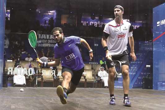 Egyptu2019s Karim Abdel Gawad (left) in action against Germanyu2019s Simon Rosner during their second round Qatar Classic Squash match at Khalifa International Tennis and Squash Complex in Doha yesterday. PICTURE: Jayan Orma
