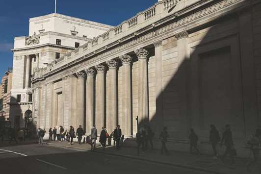 Pedestrians walk past the columns of the Bank of England in the City of London. In 2014, Britain became the first Western country to issue an Islamic bond, raising u00a3200mn ($268mn) from a five-year deal that was 10 times oversubscribed.