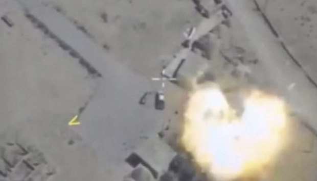 A still image taken from a video footage and released by Russia's Defence Ministry on October 3, 2017, shows a missile hitting a building which Defence Ministry said was an Islamic State target at an unknown location in Syria.