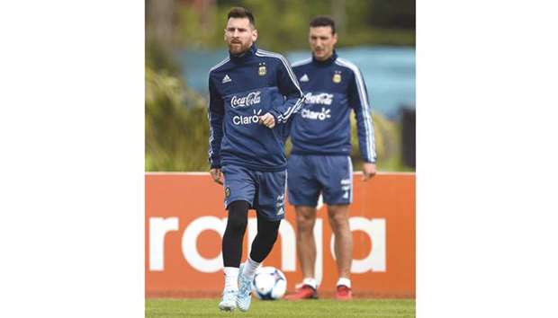 Argentinau2019s forward Lionel Messi gestures during a training session in Ezeiza, Buenos Aires yesterday.