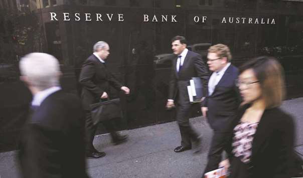 Pedestrians walk outside the Reserve Bank of Australia in Sydney. The RBA has slashed rates by 300 basis points since November 2011 to 1.50% as the country wrestles with its transition away from an unprecedented boom in mining investment.