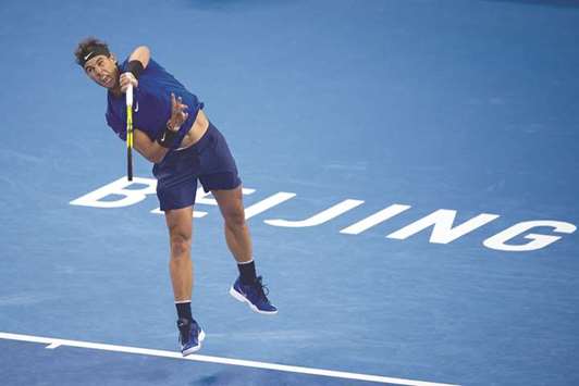 Rafael Nadal of Spain serves during his match against Lucas Pouille of France at the China Open in Beijing yesterday. (AFP)