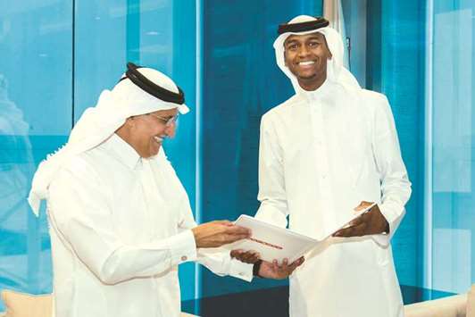 Ooredoo chairman His Excellency Sheikh Abdulla bin Mohamed bin Saud al-Thani (left) with Mutaz Barshim yesterday.