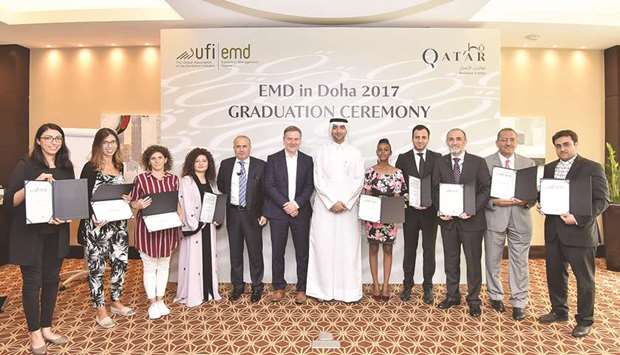 Local and regional business events professionals who completed the Event Management Degree are seen with QTAu2019s Ahmed al-Obaidli.