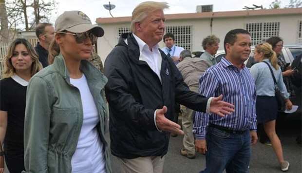 US President Donald Trump and First Lady Melania Trump visiting residents affected by Hurricane Maria in Guaynabo, west of San Juan, Puerto Rico on Tuesday.