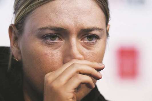 Maria Sharapova of Russia listens to a question at a press conference after losing her match against Simona Halep of Romania at the China Open in Beijing yesterday. (AFP)
