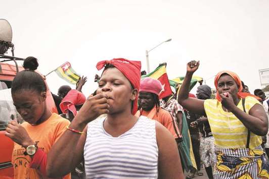 Opposition supporters blow whistles during a protest yesterday in Lome.