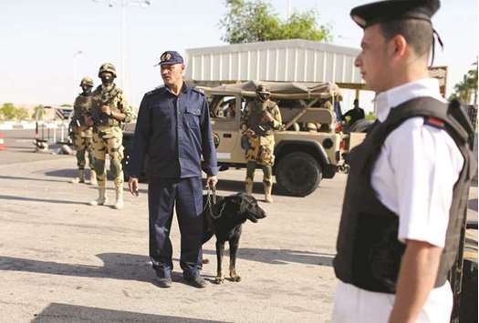 Police inspect cars entering the airport of the Red Sea resort of Sharm el-Sheikh in this photo dated November 7, 2015. Egyptu2019s economy has been struggling to recover since a 2011 uprising scared tourists and investors away, two main sources of foreign currency.