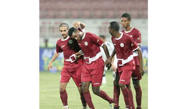 Al Markhiya players celebrate after their win over Al Sadd in the QSL Cup yesterday. PICTURE: Othman Iraqi