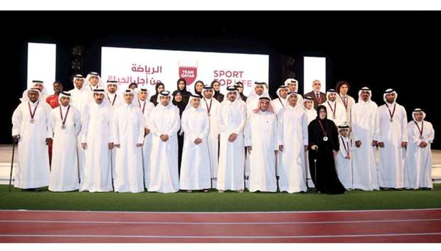QOC president His Excellency Sheikh Joaan bin Hamad al-Thani, vice presidents His Excellency Sheikh Saud bin Ali al-Thani and Dr Thani al-Kuwari with other officials and winners at the Sports Excellence Awards ceremony. PICTURES: Anas Khalid