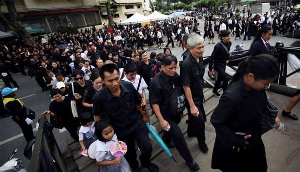 Well-wishers line up to pay respect to late Thai King Bhumibol Adulyadej near the Grand Palace in Bangkok