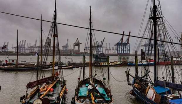 Dark clouds hang over boats at the port of Hamburg on Thursday.