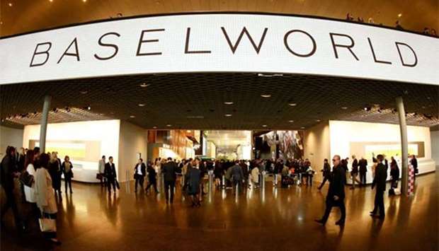 People walk in front of the main entrance of the Baselworld fair in Basel. Reuters file picture