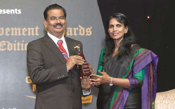 RECOGNITION: Nazerath Charles receives an award from R Sreelekha, the first Indian police officer from Kerala, on behalf of the Kerala Chamber of Commerce. The first edition of the Golden Achievements Awards Doha was held in town recently.