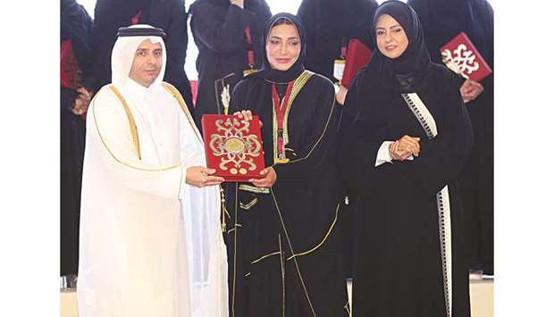 HE the Minister of Education and Higher Education Mohamed Abdul Wahed Ali al-Hammadi honours some of the teachers during the celebrations.